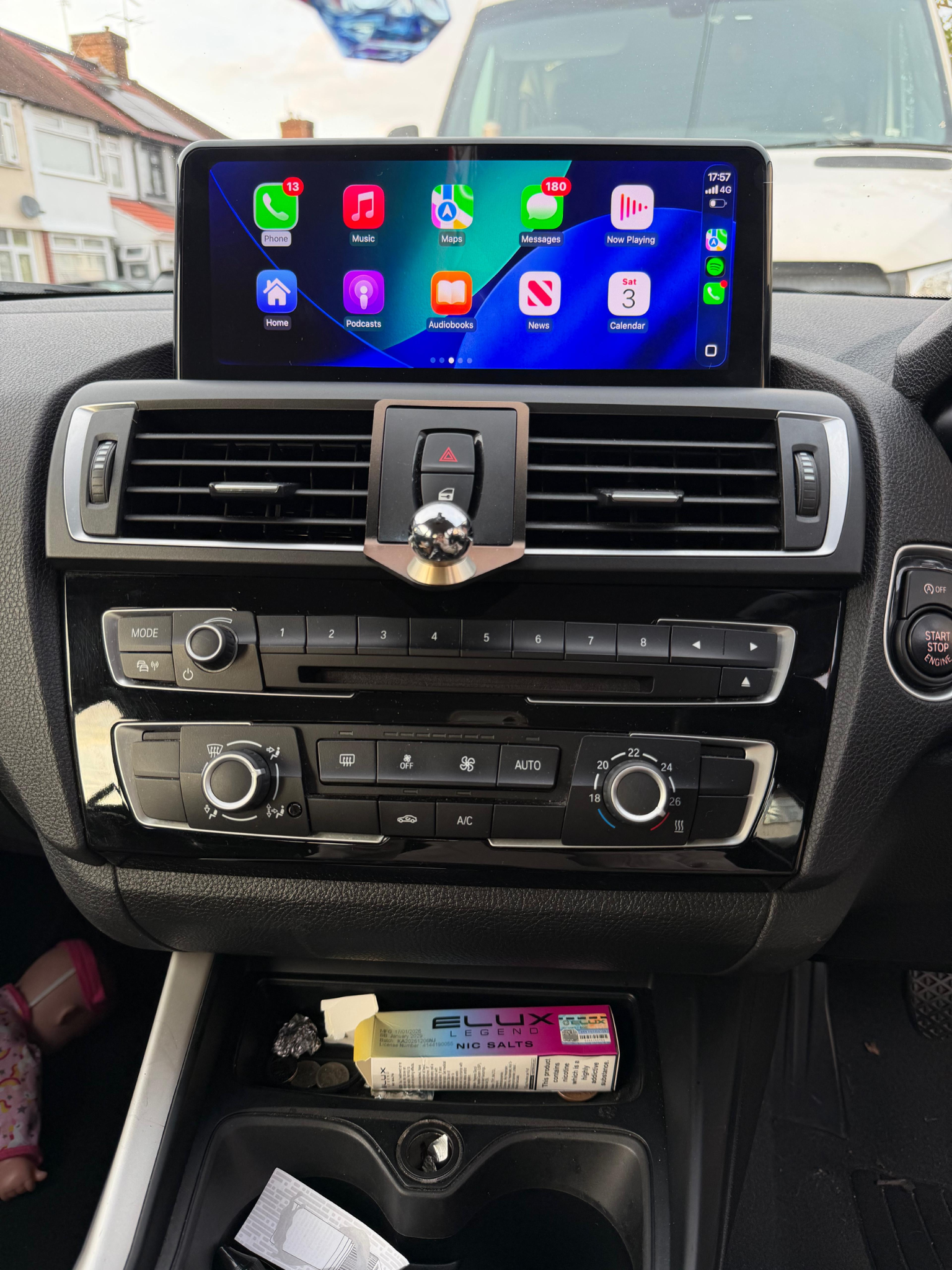 Aftermarket screen fitted in a BMW displaying Apple CarPlay