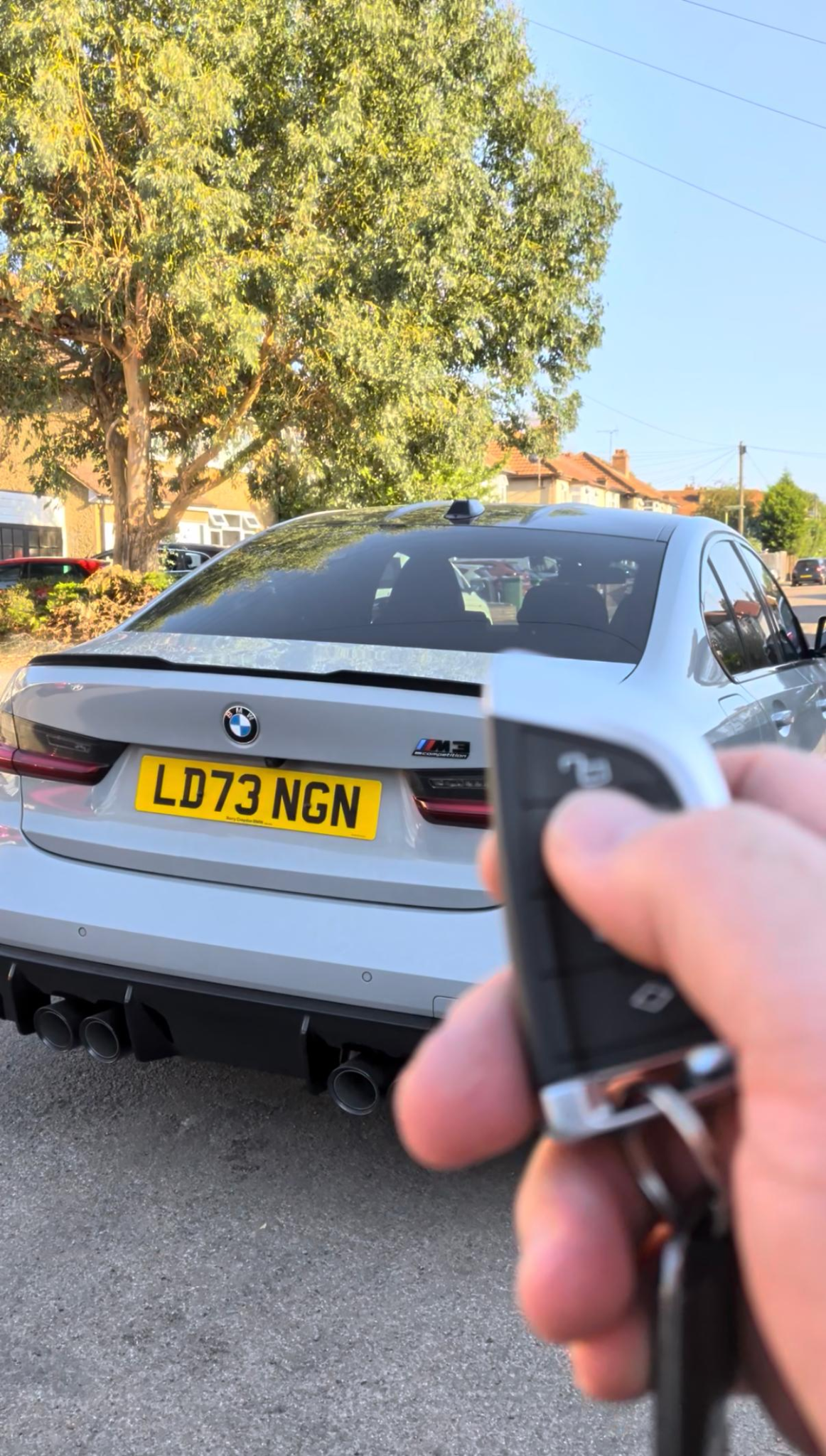 BMW M3 with its key fob for remote start activation